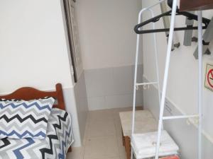 Postel nebo postele na pokoji v ubytování Recanto Suítes