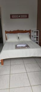 Una cama o camas en una habitación de Pousada da Cléo 42 fotos más