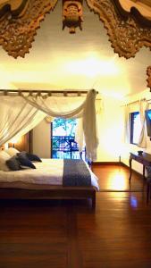 Tempat tidur dalam kamar di Villa Tengkek Karimunjawa