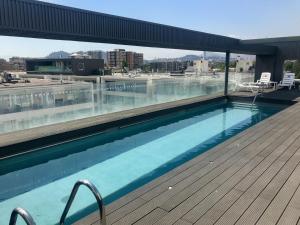 Bazén v ubytování Ideal departamento en el corazón de Los Dominicos nebo v jeho okolí