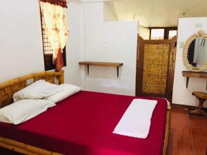 Postel nebo postele na pokoji v ubytování The Pelicans Resort