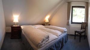 En eller flere senge i et værelse på Apartment Kärntnerhaus I