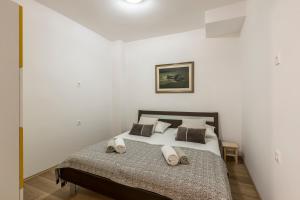 Postel nebo postele na pokoji v ubytování HVAR CENTRAL APARTMENT