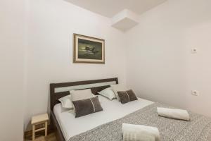 Postel nebo postele na pokoji v ubytování HVAR CENTRAL APARTMENT