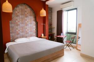 Postel nebo postele na pokoji v ubytování Joy Hotel Phú Yên