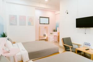 a hospital room with a bed and a tv at Joy House in Tuy Hoa