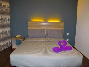 Postel nebo postele na pokoji v ubytování Classical Boutique Hotel