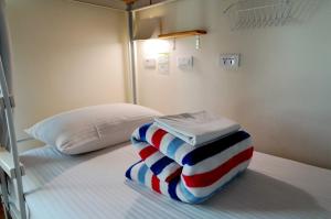 A bed or beds in a room at 安蘭居旅店 An Lan Jie Hotel
