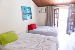 Postel nebo postele na pokoji v ubytování FLATS VASCONCELOS