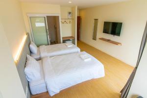 Ένα ή περισσότερα κρεβάτια σε δωμάτιο στο Matini Premium @ Klong 1