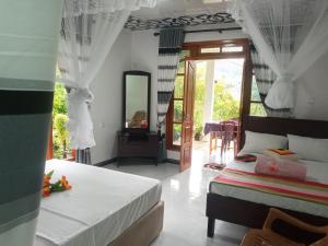 Postel nebo postele na pokoji v ubytování Mellow Homestay