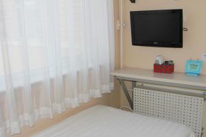 TV a/nebo společenská místnost v ubytování Beijing Sicily Hotel