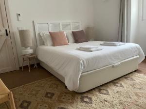En eller flere senge i et værelse på Casa Teresa