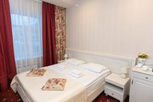 Postel nebo postele na pokoji v ubytování АВРОРА гостиница