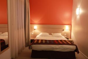 Postel nebo postele na pokoji v ubytování Esatitude Hotel