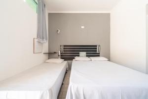 Llit o llits en una habitació de Hotel Campolim