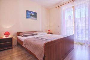 Postel nebo postele na pokoji v ubytování Mladen