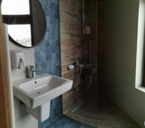 a bathroom with a sink and a mirror at Boutique Hotel St Nikolas by Skar in Kruševo