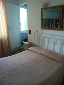 Postel nebo postele na pokoji v ubytování Hotel Antico Capon