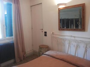 Postel nebo postele na pokoji v ubytování Hotel Antico Capon