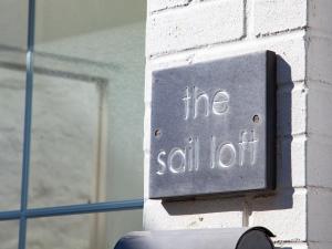 a sign on a building that reads the sell lot at The Sail Loft in St Ives