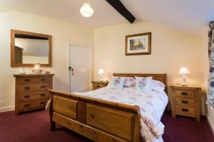 Ένα ή περισσότερα κρεβάτια σε δωμάτιο στο Sunbeam Cottage