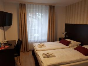 Postel nebo postele na pokoji v ubytování Hotel und Restaurant Rosenkranz + 14 fotografií