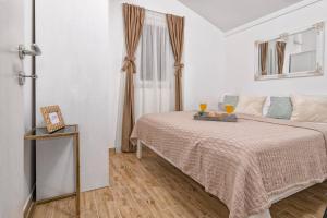 Posteľ alebo postele v izbe v ubytovaní Holiday Home Secret