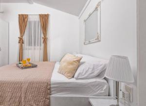 Posteľ alebo postele v izbe v ubytovaní Holiday Home Secret