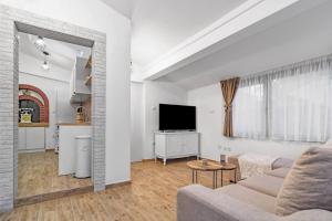 Televízia a/alebo spoločenská miestnosť v ubytovaní Holiday Home Secret