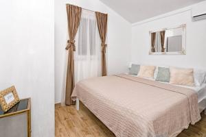 Posteľ alebo postele v izbe v ubytovaní Holiday Home Secret