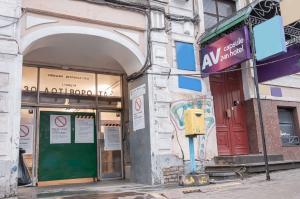 a building with a parking meter in front of a store at AV-2 capsule hotel in Kyiv