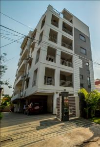 a large white building with a car parked in front of it at HILL VIEW JUBILEE HILLS in Hyderabad