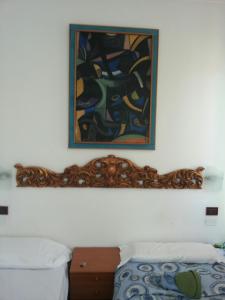 Postel nebo postele na pokoji v ubytování Hotel Antico Capon