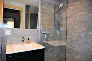 a bathroom with a sink and a shower at Carpe Diem 2 in Fiesch +22 photos