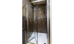 a shower in a bathroom with a glass door at Dovedale in Keswick +15 photos