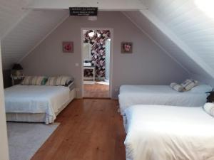 Ein Bett oder Betten in einem Zimmer der Unterkunft Les chambres de Marie