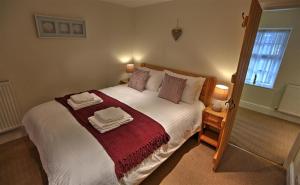 Llit o llits en una habitació de Townfoot Cottage