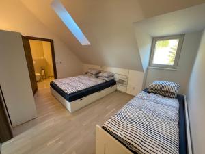 Un pat sau paturi într-o cameră la Horní Mísečky Apartmán 021, up to 10 persons