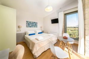 Giường trong phòng chung tại Panormo Villas Crete - Iasion & Dimitra
