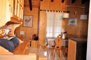 a bedroom with a bed and a table and chairs at Melchior in Fiesch