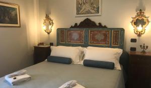 Postel nebo postele na pokoji v ubytování Agriturismo Collerisana