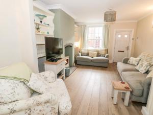 Posezení v ubytování Heath Cottage