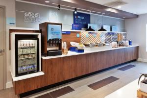 a store with a checkout counter in a store at Holiday Inn Express Rome-East by IHG in Rome