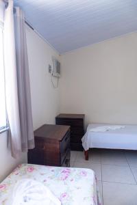 Postel nebo postele na pokoji v ubytování FLATS VASCONCELOS