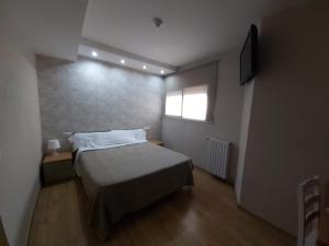 Ένα ή περισσότερα κρεβάτια σε δωμάτιο στο Hotel 139
