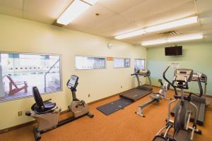 a gym with three exercise bikes in a room at Canad Inns Destination Centre Polo Park in Winnipeg