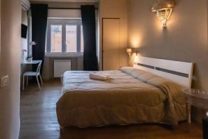 Postel nebo postele na pokoji v ubytování CconfortHotels R&B Cavour