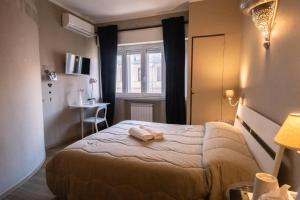 Postel nebo postele na pokoji v ubytování CconfortHotels R&B Cavour