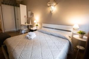 Postel nebo postele na pokoji v ubytování CconfortHotels R&B Cavour